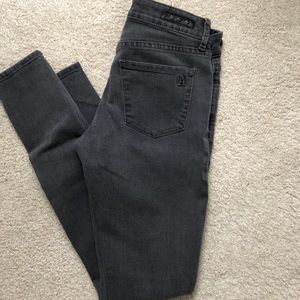 Gray jeans with rips in the knees